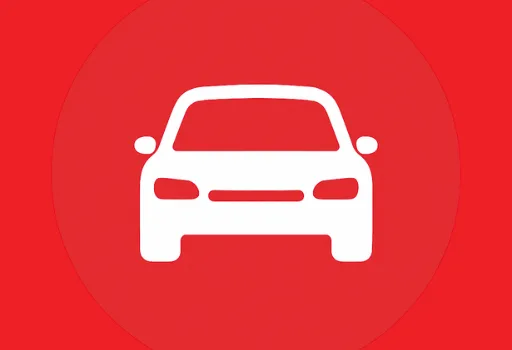 Sedan automobile with headlights and grille on red background.